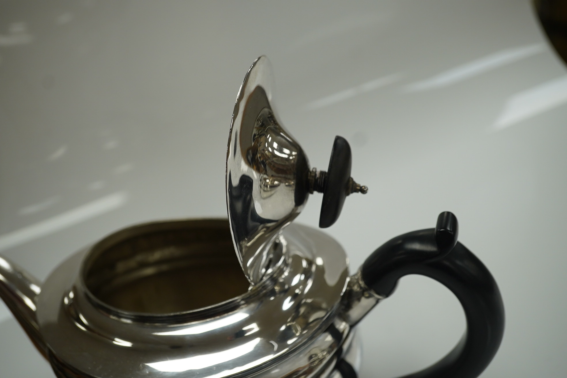 An Edwardian silver teapot and two handled sugar bowl by Charles Stuart Harris & Sons, London 1907, gross weight 23.4oz. Condition - poor to fair